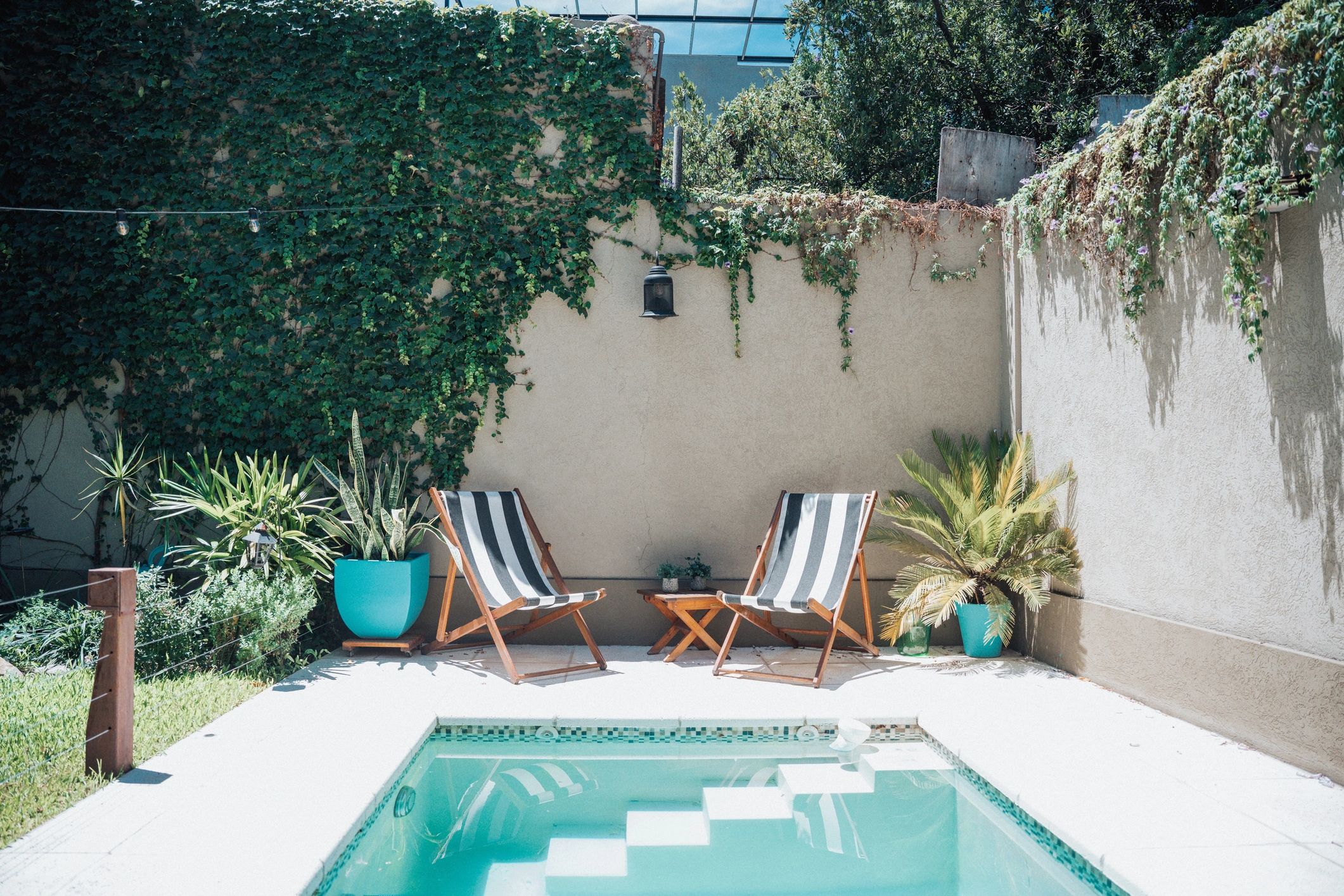 Swimming pool with sun chairs at the hotel