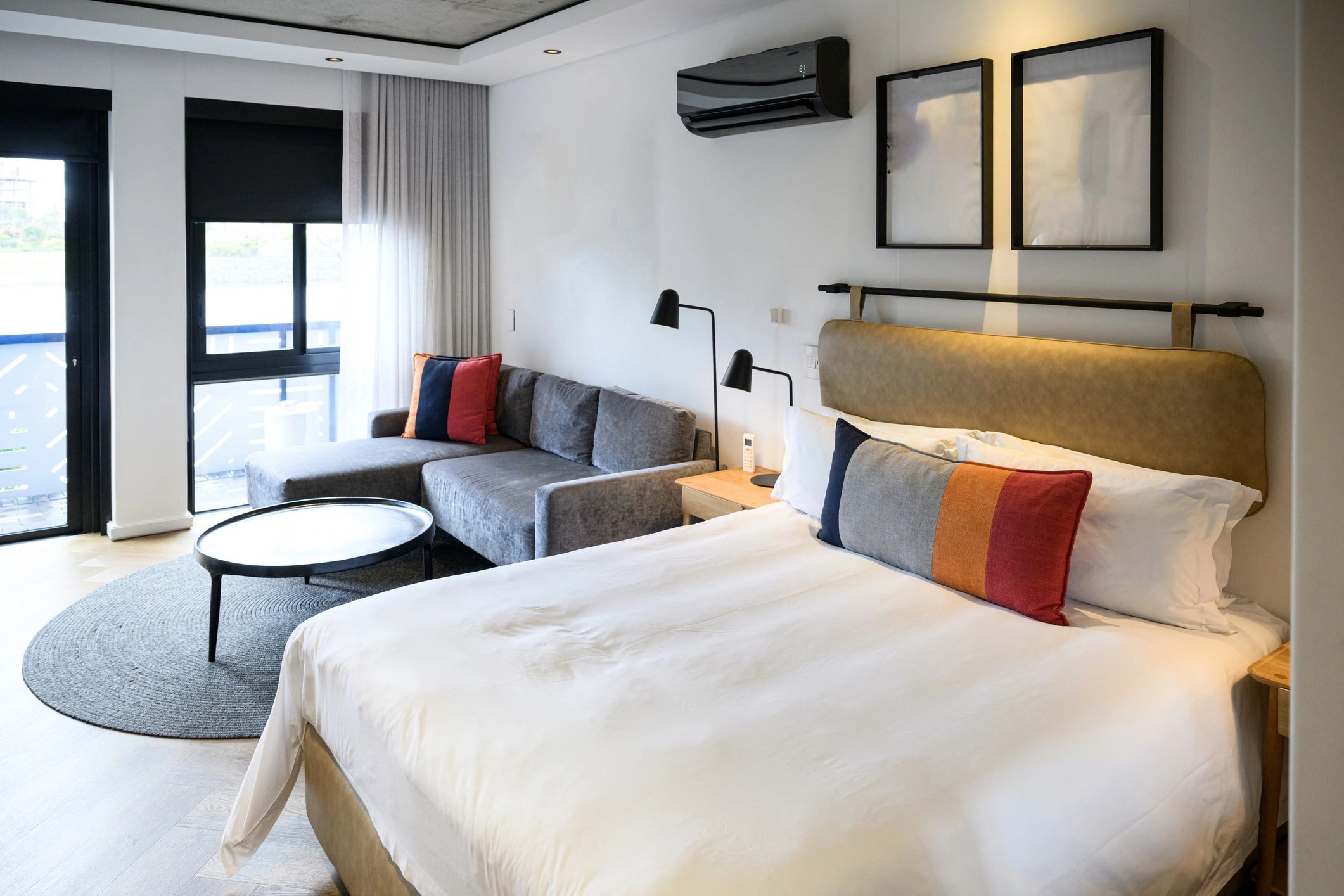 Contemporary hotel room interior with king bed